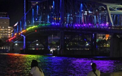 Activists light up Jacksonville bridge in rainbow colors after DeSantis ban