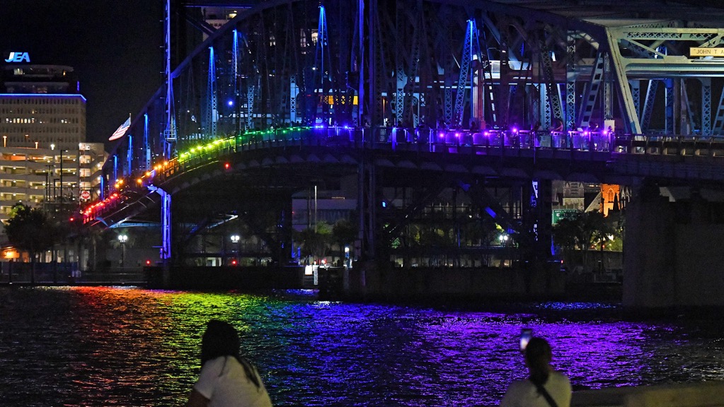 Activists light up Jacksonville bridge in rainbow colors after DeSantis ban